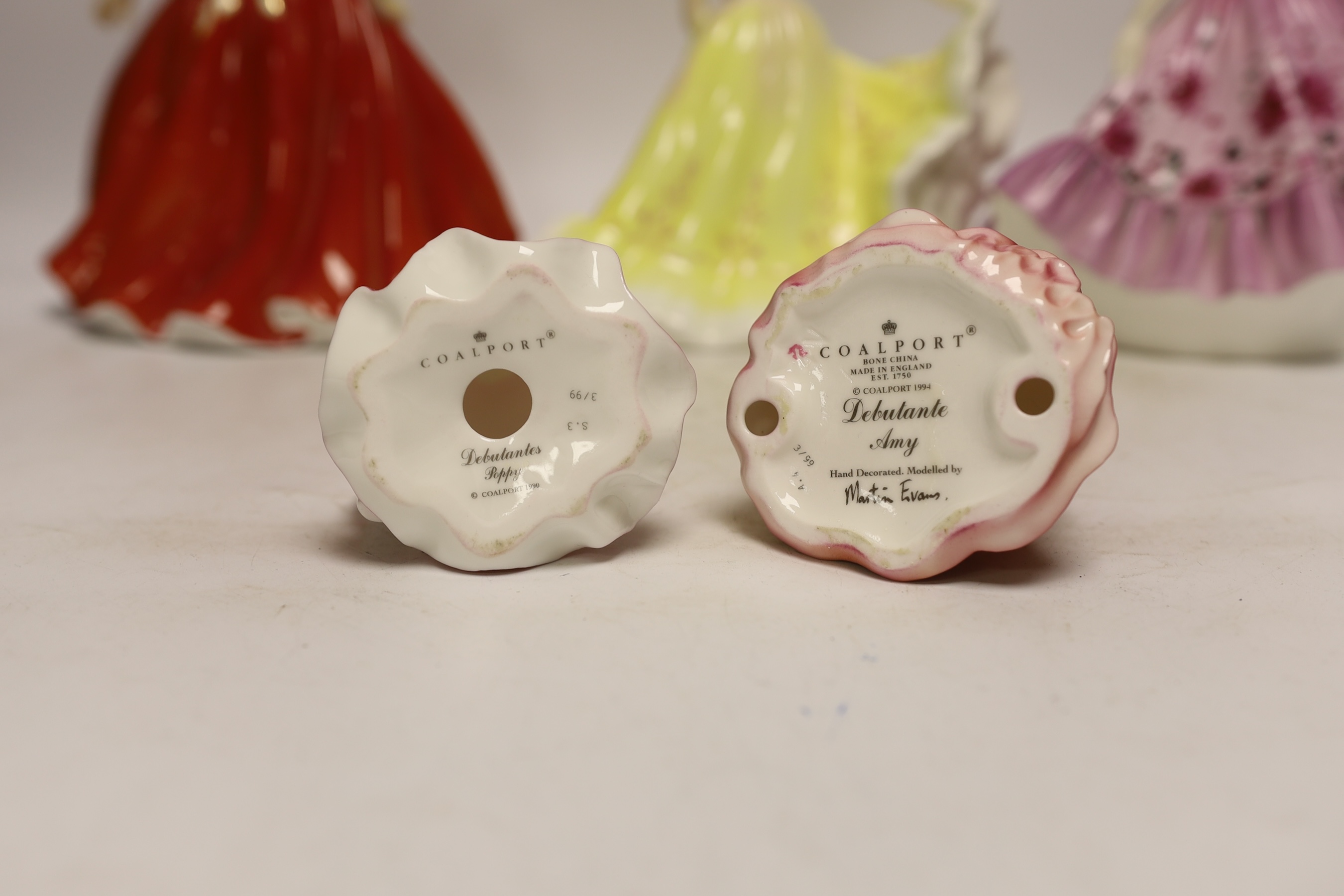 Three Coalport figurines and two Royal Doulton similar figurines